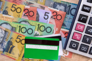 cash credit card with australian dollar banknotes